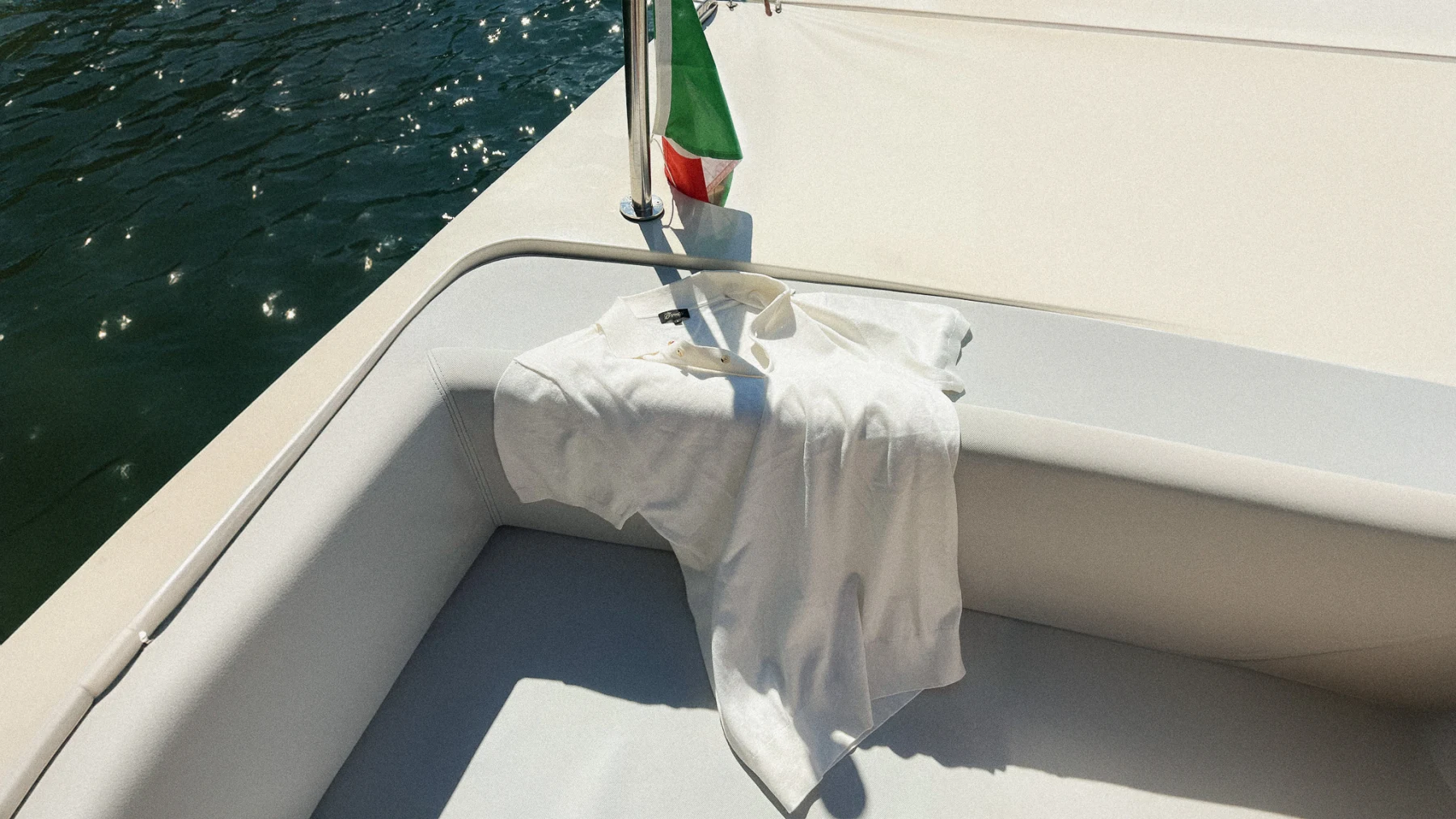 Benetti white polo photographed on a boat